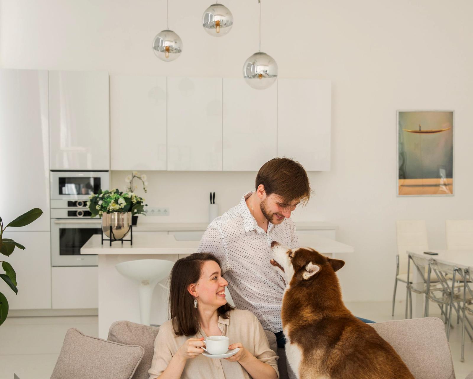 A family relaxing on a sofa in a cool Florida living room