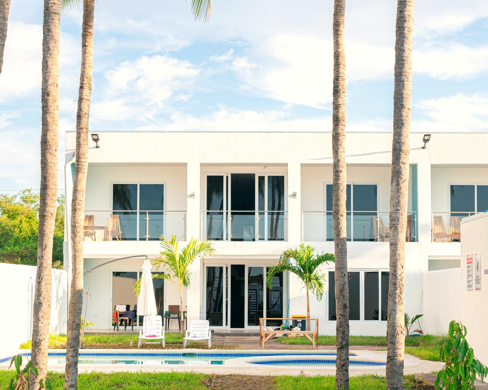 A modern Florida-style home with palm trees